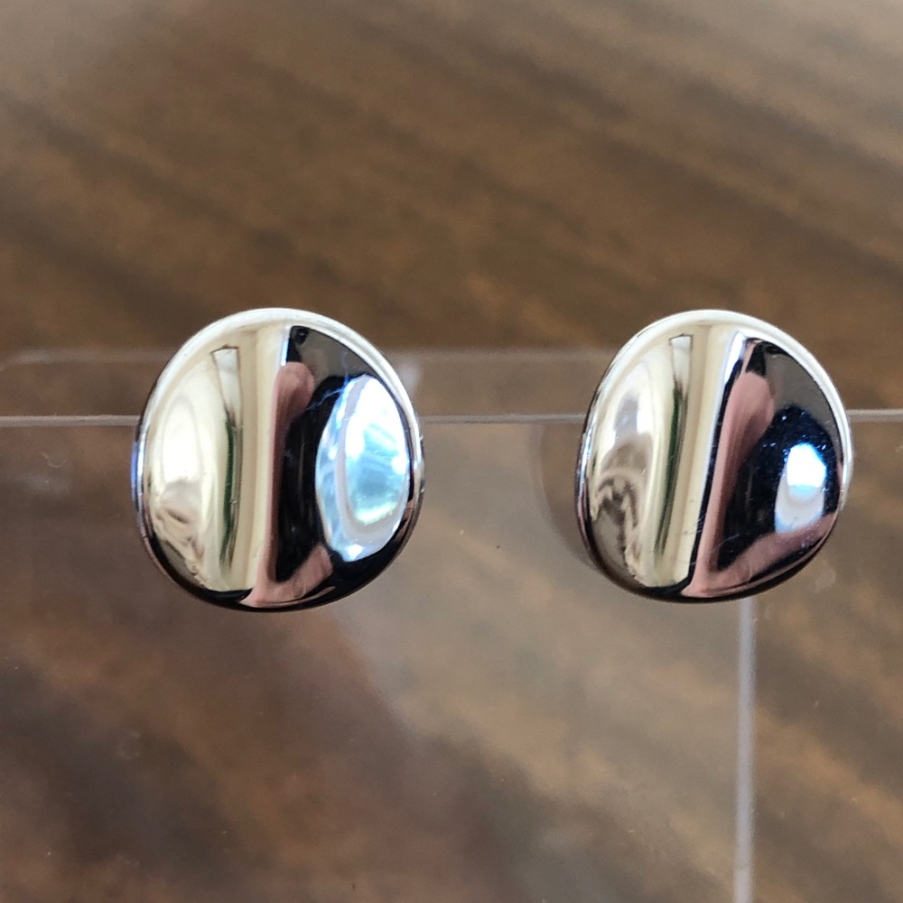Vintage Avon curved disc clip on earrings silver tone